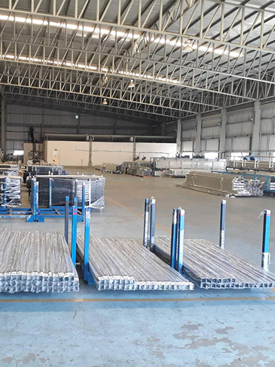 Laser cutting machine processing aluminum sheets at Royal Metal